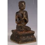 A Chinese bronze study of Buddha, kneeling with hands clasped, 14cm H.