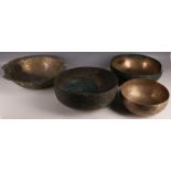 A collection of four Persian metalwork bowls, with inscribed decoration, including calligraphic