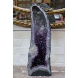 A tall amethyst geode (60.4cm high).