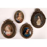 A pair of oval portrait miniatures of women in 18th Century dress in filigree frames, together