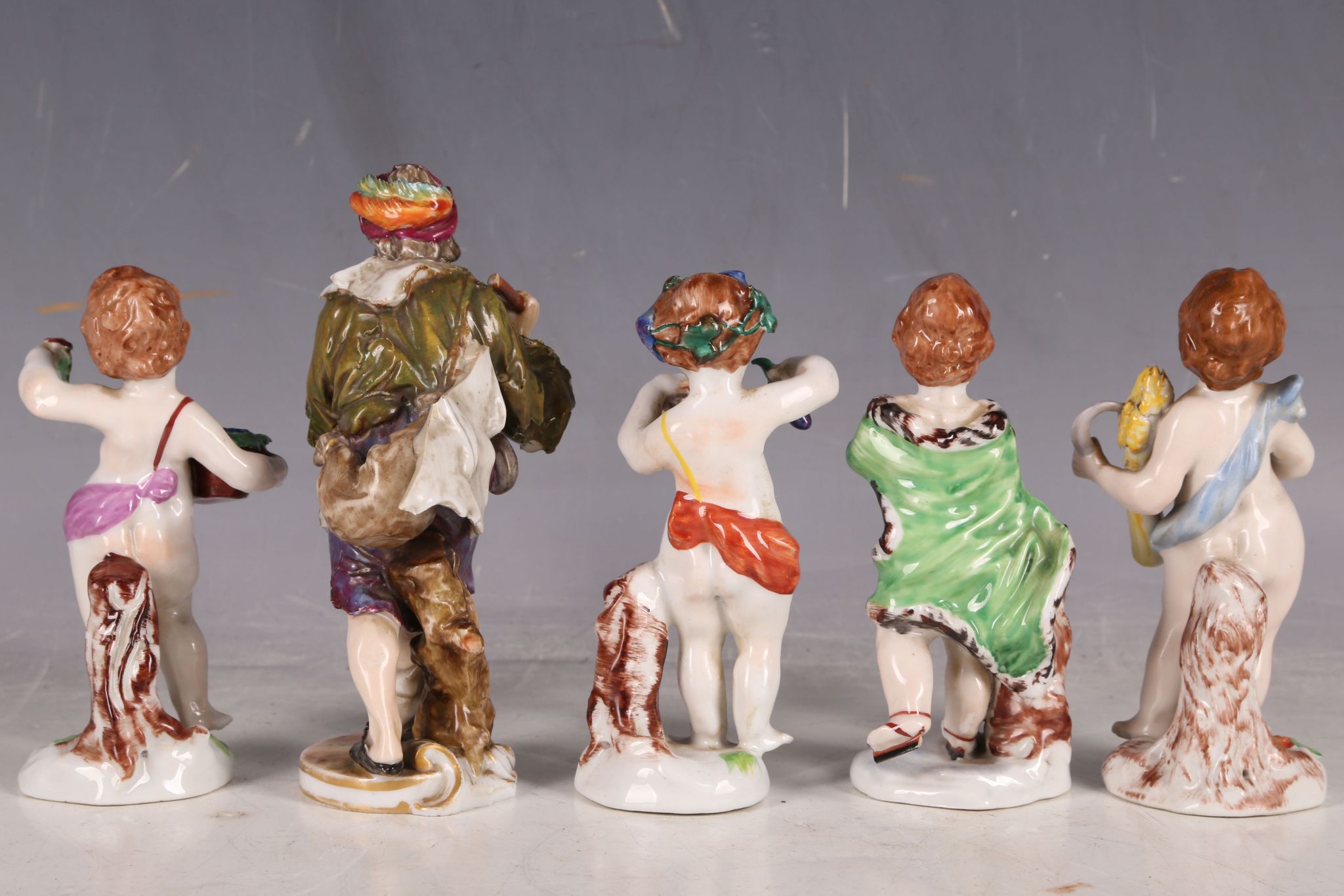 Five 19th Century Crown Naples porcelain figures, to include putti, two carrying flowers, and a - Image 2 of 3