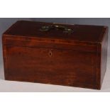 A 19th Century mahogany and crossbanded tea caddy, the hinged lid opening to reveal a blue and white
