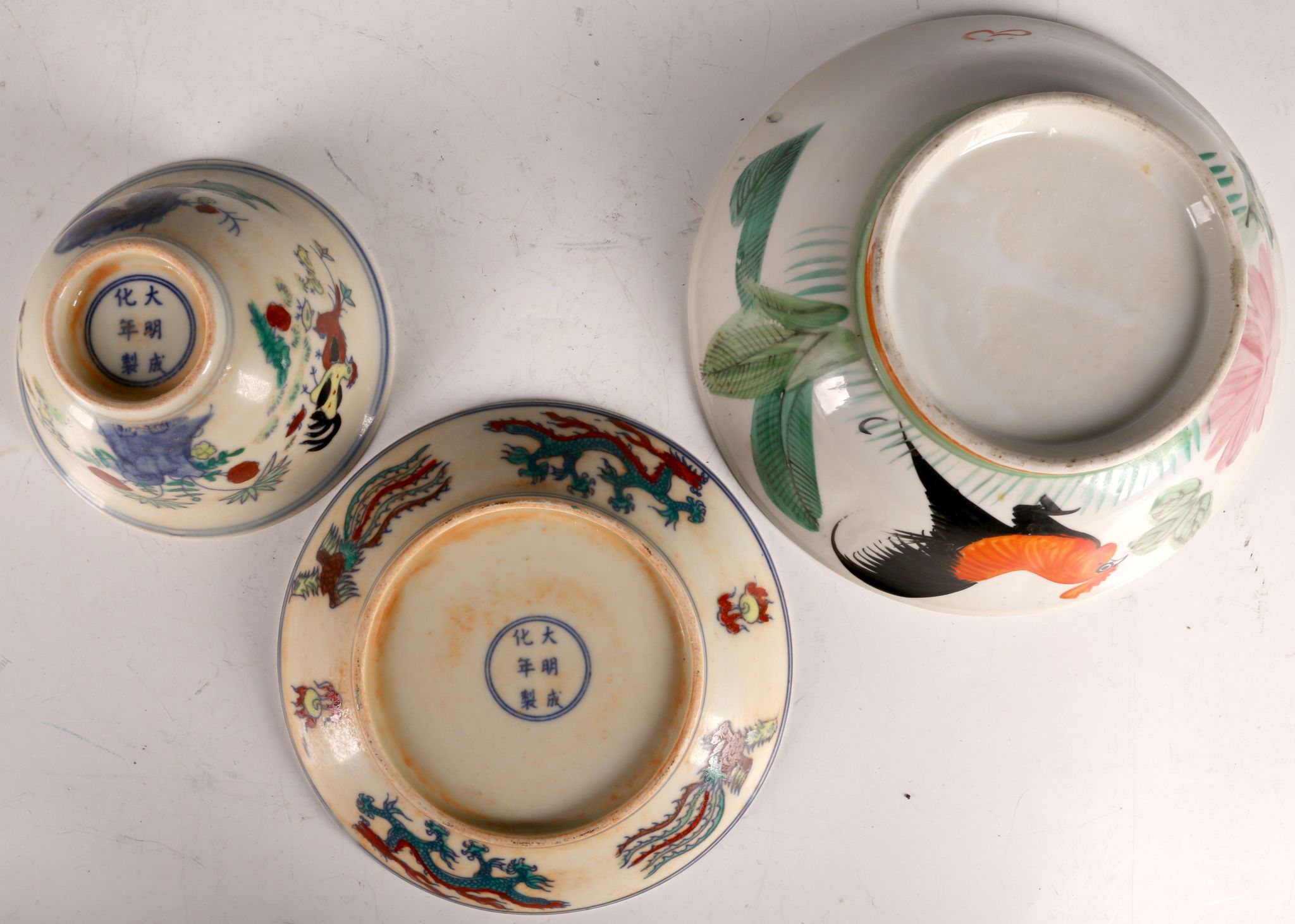 A Chinese rice bowl, chicken decoration and matching saucer with dragon, six character marks and - Image 3 of 3