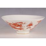 A Chinese 20th Century porcelain pedestal flared bowl, painted outside in iron red glazes with a