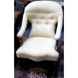 A Victorian rosewood button back easy chair, in yellow upholstery, raised on turned legs and