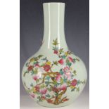 A Chinese pear shaped vase, decorated in enamels with peaches and bats, yongzheng mark, but