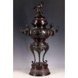 An Oriental late 19th / 20th Century bronzed incense burner, sparrow surmount with floral and branch