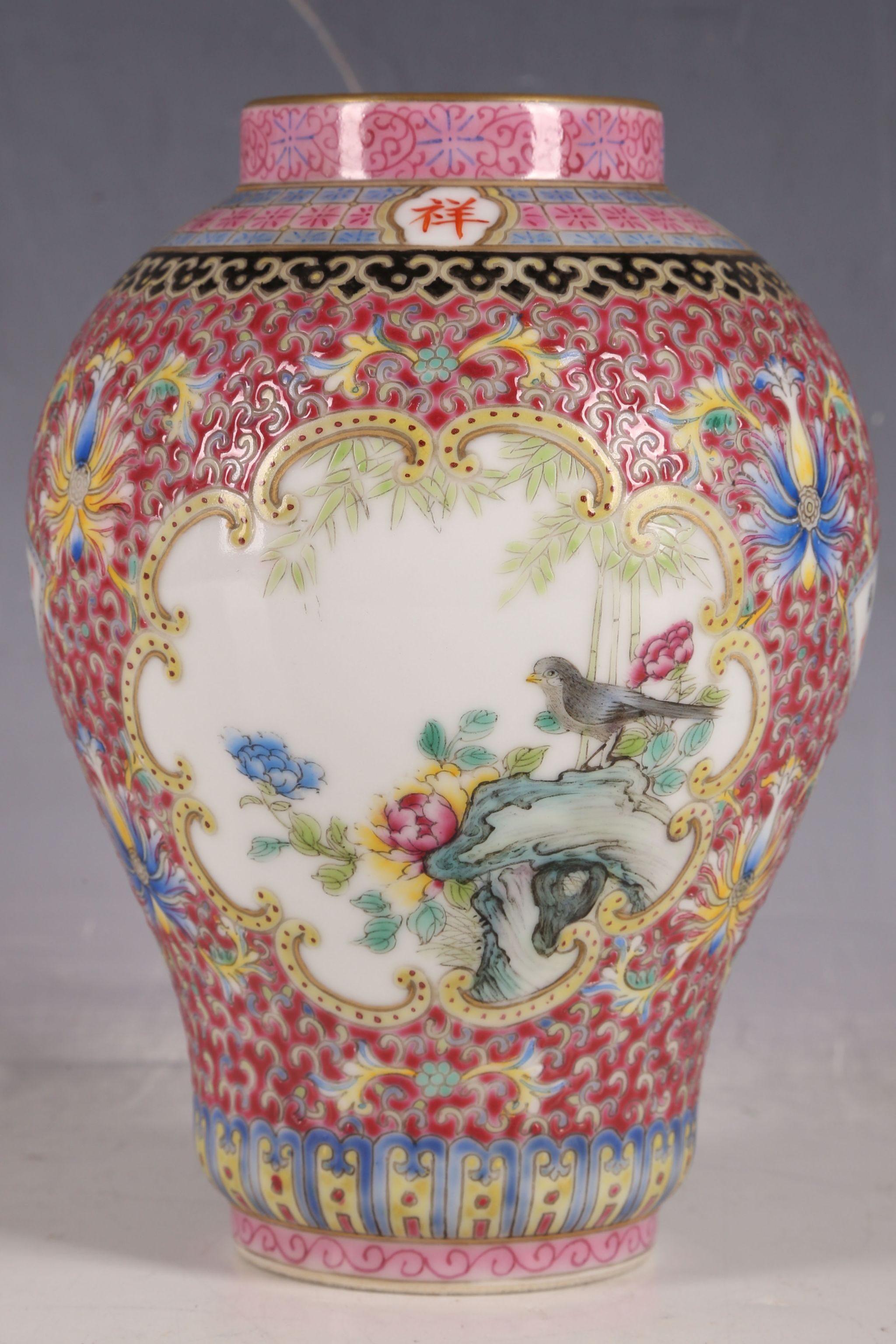 A Chinese balloon vase, character marks to collar, all over enamel decoration, two panels with birds