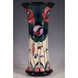A Moorcroft tube-line vase, everted rim, Mackintosh rose pattern, marks for Ann Bishop, 25.9cm H.