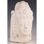 After the Antique, white granite carved head of a Cambodian Buddha.