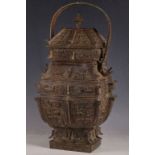 A Chinese archaic form bronze jar of temple design, scrolls and temple dogs to lid, insects to