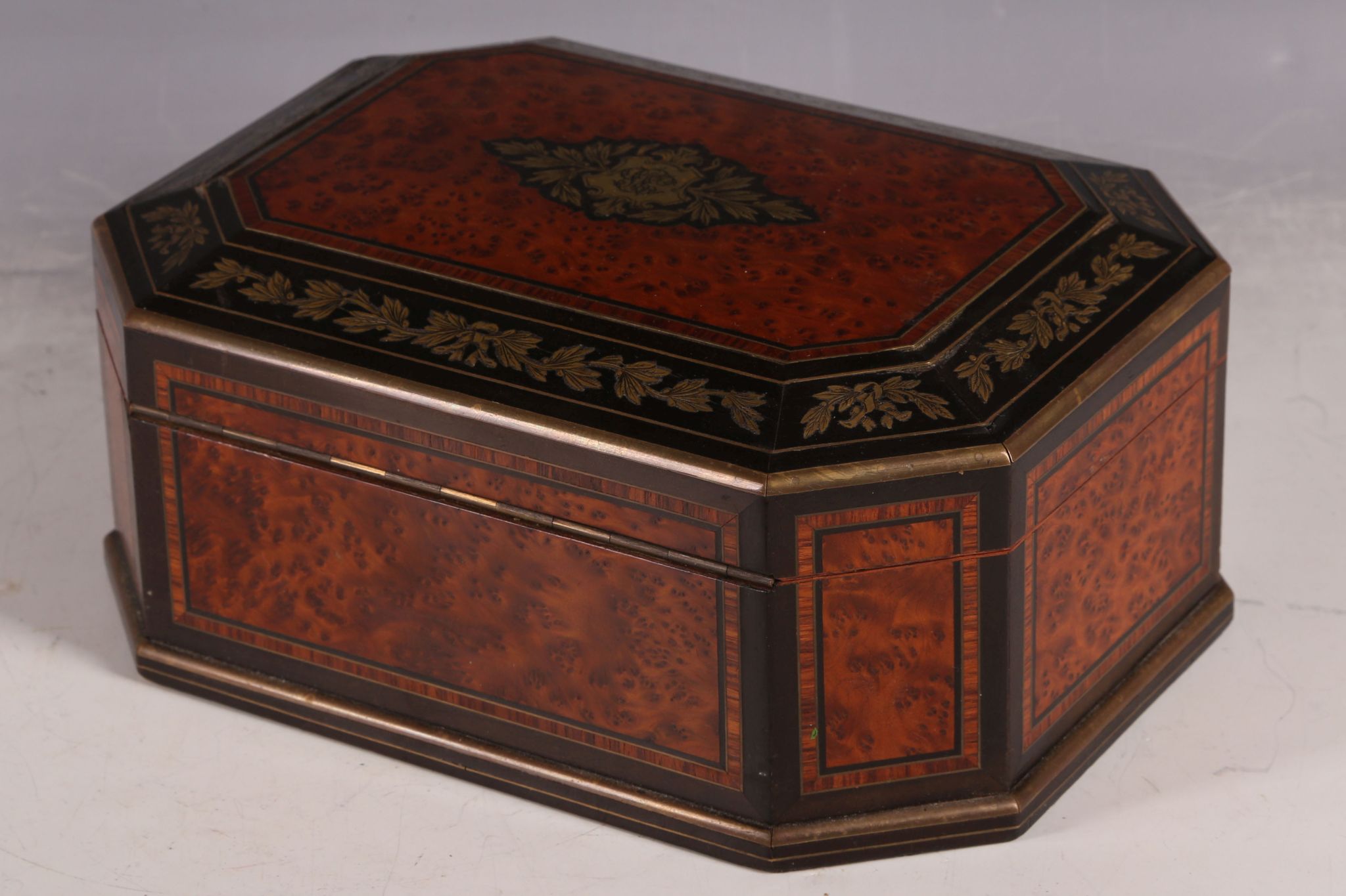 A 19th Century amboyna casket, with ebonised and gilt metal inlaid border decoration, and blue - Image 4 of 5