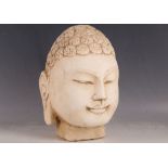 A carved marble Buddha's head, 29cm H.