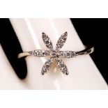 An 18ct white gold and diamond set floral dress ring.