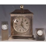 A small hallmarked silver Asprey desk clock, and two other silver plated cased clocks. (3)