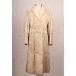 A vintage full length white Coney fur coat, with collar, long sleeves, side pockets, satin lined (