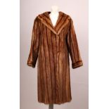 A vintage full length auburn striped fur coat, by Hockey Furs, Purley, Surrey, with large film