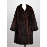 A vintage dark brown musquash three quarter length ladies jacket, with collar, bracelet sleeves,