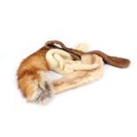 Four vintage fur stoles, including an ermine, with four legs, two tails, a soft brown and a light