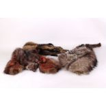 A vintage fox fur shoulder cape and two fox fur stoles, all lined, including heads and feet. (3)