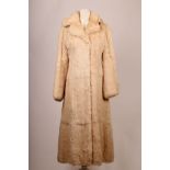 A 1960s full length white rabbit fur coat, with leather and gilt button detail, and a detachable