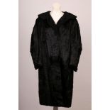 A good vintage full length sheared black fur coat with a large Astrakhan collar, by Pelz-Vogel,