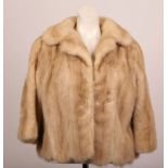 A 1970s soft beige mink bolero jacket, with small collar, bracelet sleeves, satin lined, by Alma