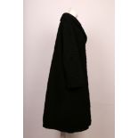 A vintage, black Astrakhan fur coat, with collar, full length sleeves, side pockets, satin lined (