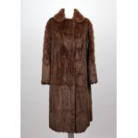 A vintage brown squirrel full length ladies fur coat, with collar, side pockets, satin lined (size