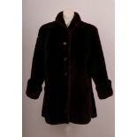 A good 1940s Jacques Heim, Beau Mouton brown beaver long length jacket, with collar, turned up