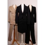 Three vintage designer suits, including a Christian Dior navy and red pin stripe skirt suit, a Dolce