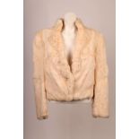 A 1960s white rabbit fur jacket by Split End Ltd , with button collar detail, straight collar,