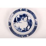 A Chinese blue and white saucer dish. Qing Dynasty, Kangxi (1662-1722). Delicately painted with a