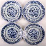 A set of four Chinese matching blue and white plates. Qing dynasty, 18th Century. With floral