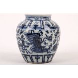 A Chinese blue and white oviform jar. Late Ming dynasty. The rounded body painted with two phoenixes