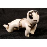 A Chinese cizhou-ware recumbent boy brush rest. Yuan dynasty or later. Primitively modelled in the