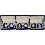Six Baccarat paperweights, studies of French and American notorieties in cameo form, cased in pairs,
