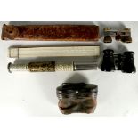 An Otis King's cylindrical calculator, Taniya slide rule with leather case and opera glasses. (4)