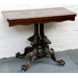 A fine 19th Century flame mahogany fold-over card table with a shaped apron, raised on a