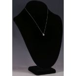 An 18ct white gold mounted diamond pendant on chain, 0.71pts.
