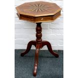 A 19th Century octagonal topped work table, with star inlaid hinged lid and raised on a turned
