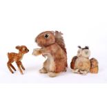 Three vintage Steiff animals, including a velvet Bambi, deer, a 'Wittie' owl, with label and