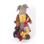 Three vintage plush rabbits, including a large handsome fellow with suede jacket and boots, and