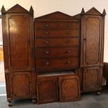 A Regency mahogany architectural wardrobe, the central section with two short over four long