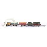 A. Distler J.D.N. boxed 0' gauge clockwork train set, locomotive and tender 7325, with two