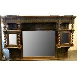A Jacobean style oak overmantel mirror, dentil frieze, leaf carving, two glazed cupboards with