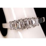 An 18ct white gold and diamond baguette cut graduated five stone ring, 1.08ct.