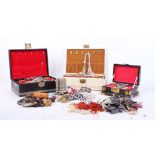 A large vintage collection of jewellery boxes and costume jewellery, including a black lacquer box