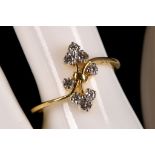 An 18ct gold and diamond set foliate cluster ring.