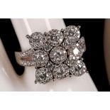 An 18ct white gold and diamond cluster ring (dia. 1.40ct).